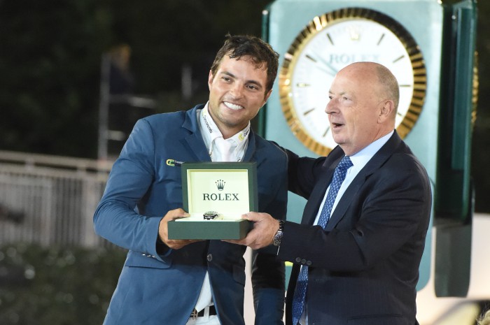 Daniel Bluman recieves his Rolex watch from Stewart Wicht, CEO & President of Rolex USA. Photo by Josh Walker for The Chronicle of the Horse