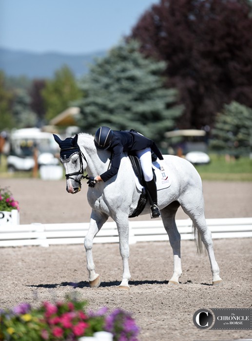 Haley Carspecken hugged Center Stage after their one-star dressage test, which has them placed second individually and helped boost the Area II team into first after dressage.